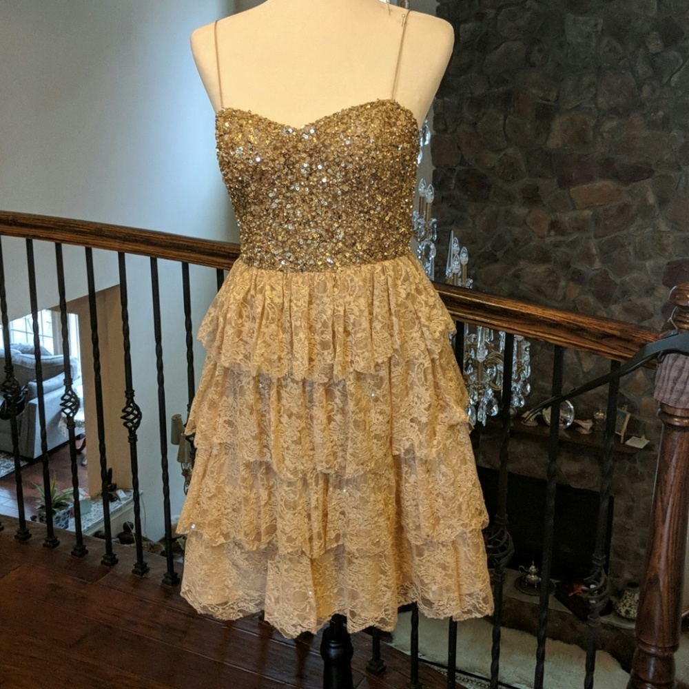 This a tan/ gold Aidan Mattox short dress size 6